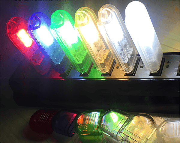 What kinds of lighting effects can be customized for the Pluto USB flash drives